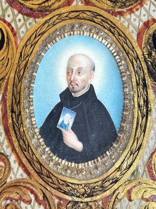 Medallion portrait on vellum set behind an elaborate enameled glass frame.