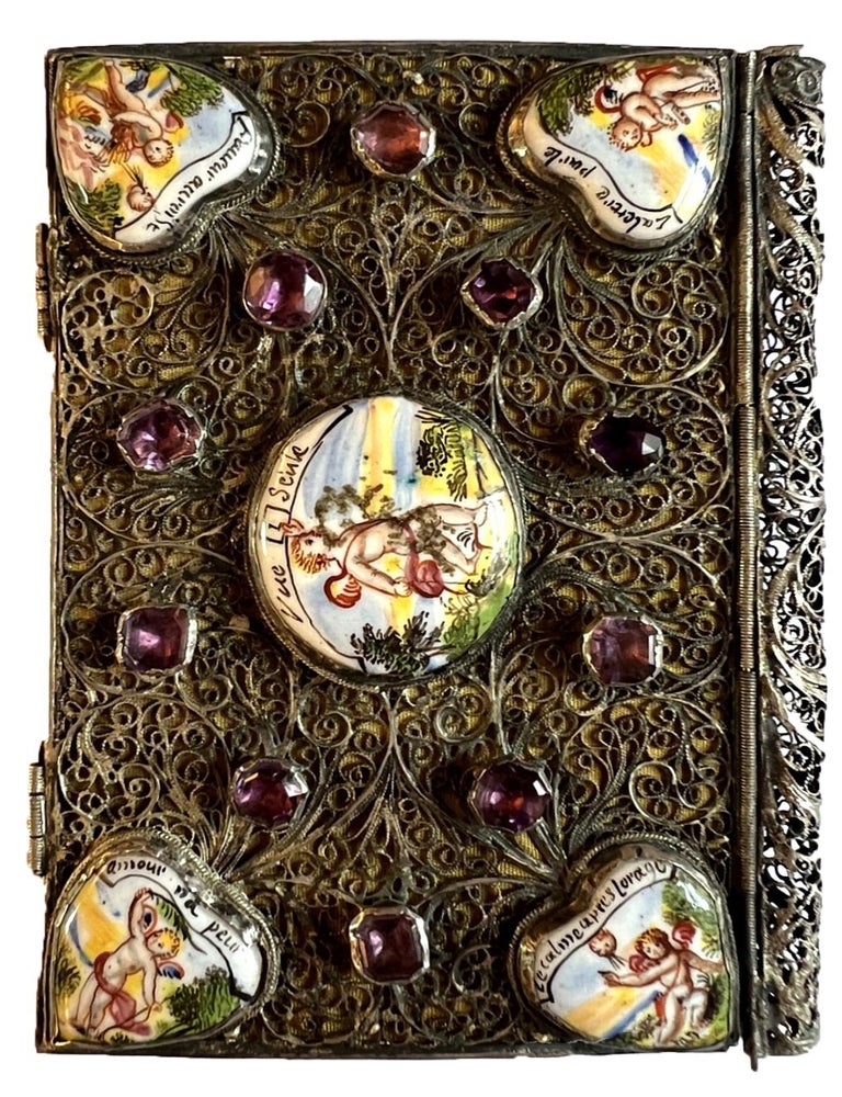 Item #4426 A miniature silver binding decorated with painted enamel plaques and glass &ldquo;jewels.&rdquo;. SILVER PLAQUE BINDING.